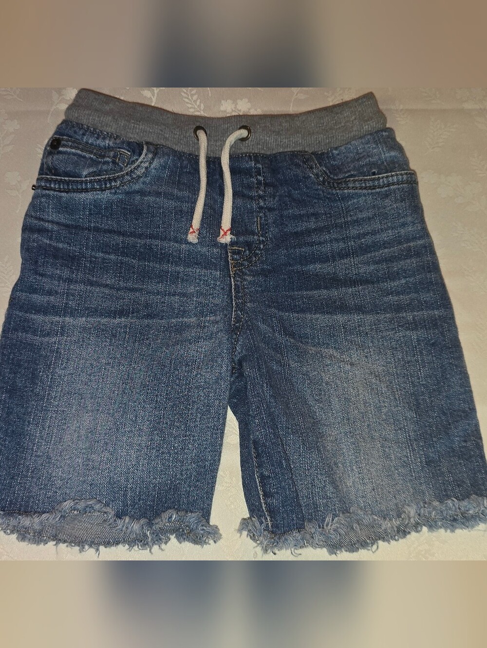 Cat & Jack frayed denim shorts featuring a dark wash